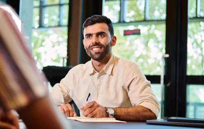 Man with pen writing