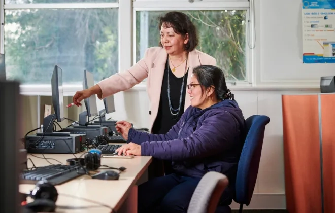 Teacher helping student