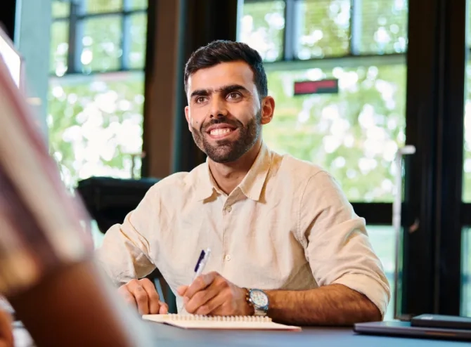 Man with pen writing