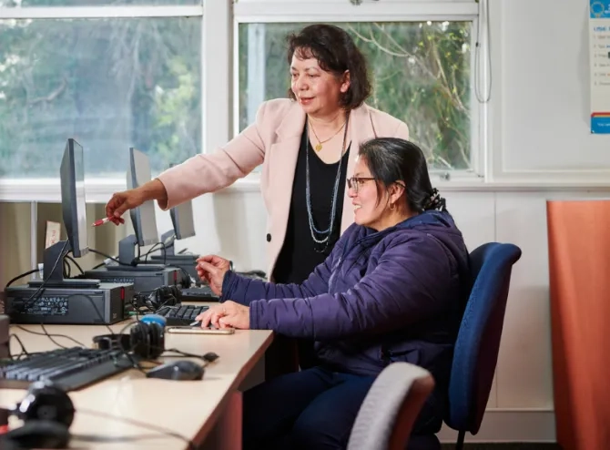 Teacher helping student